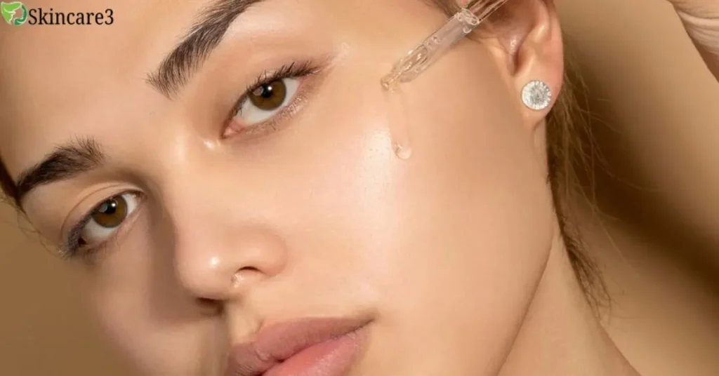 Close-up of a woman applying facial serum with a dropper to her cheek, showcasing smooth and glowing skin.